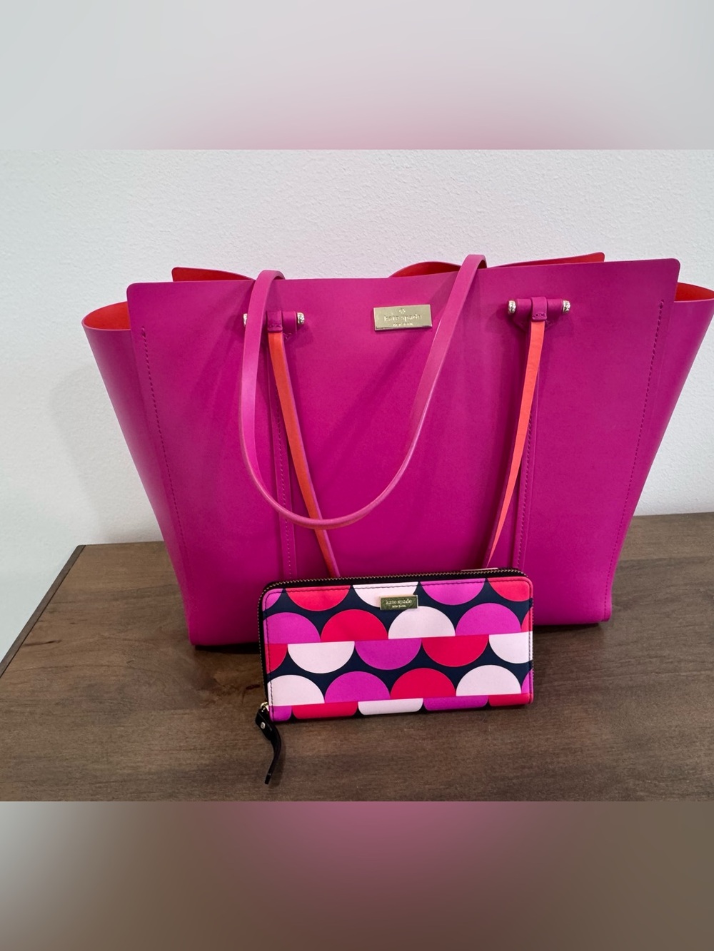 kate spade fuchsia tote with contrasting orange trim and patterned wallet